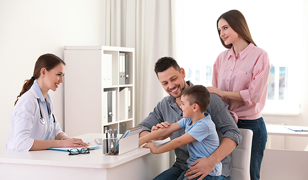 Parents and son visiting pediatrician
